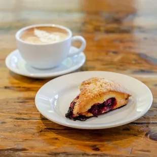 a pastry and a cup of coffee