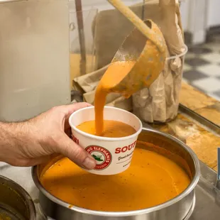 Enjoy a cup of our famous tomato orange soup!