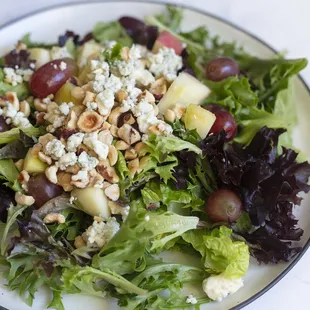Willamette Valley salad with mixed greens, hazelnuts, blue cheese, apples, and grapes with our raspberry vinaigrette