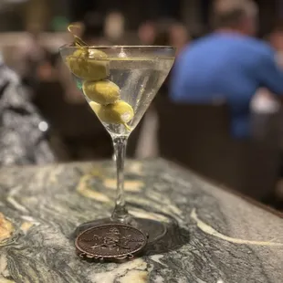Dirty martini with blue cheese stuffed olives