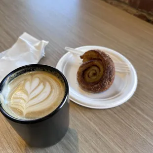 Salty Ex espresso drink served hot with a warm sticky cinnamon roll.