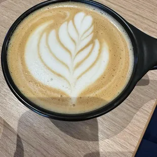 latte art in a black bowl