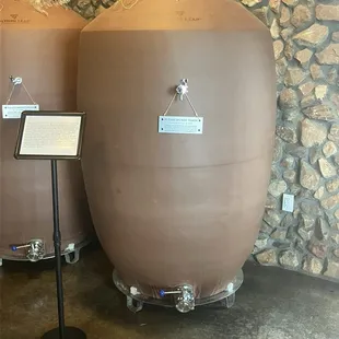 Clay pots they use for some of the wine instead of wood barrels. The sign explains how they were shipped from China.