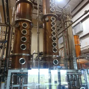 a row of copper stills