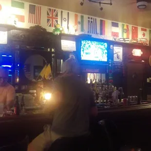 two men sitting at the bar