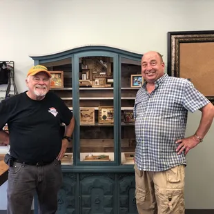 Mark and Charlie admiring Mark&apos;s crafts.