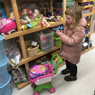 A young shopper inspects the toys.