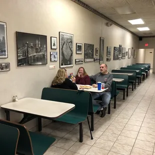 two people sitting at a table in a restaurant