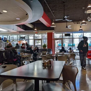 a restaurant with people sitting at tables