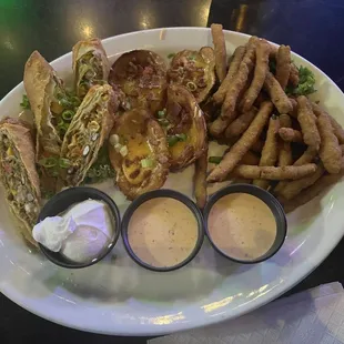 Southwest egg rolls, potato skins and fried green beans.