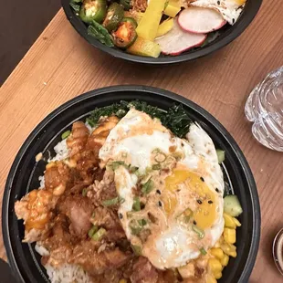 Top bowl is pork belly over rice and bottom bowl is KFC over rice