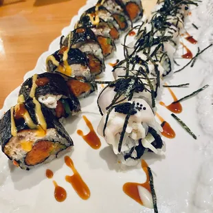 Dragon roll is spicy  and the black and white is sweeter