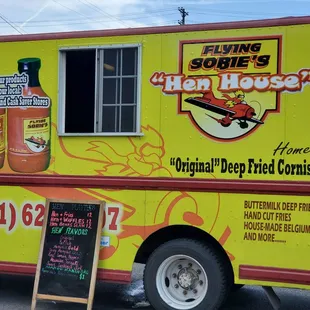 a food truck with a menu on the side