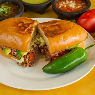 a sandwich cut in half on a plate