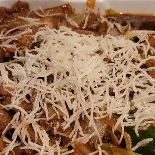 shredded cheese on top of noodles