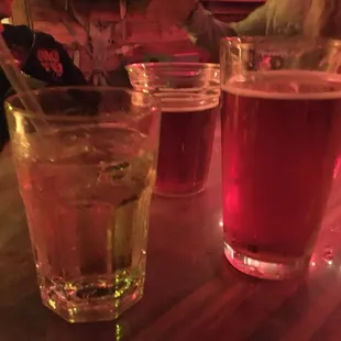 two glasses of beer and a drink