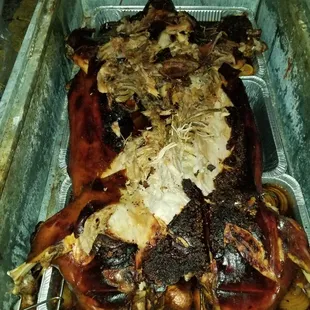 a roasting chicken in a pan