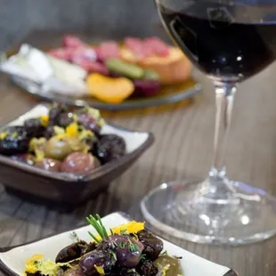 a glass of wine and a plate of food