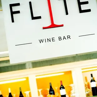 a sign for a wine bar