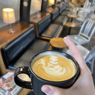 Vanilla latte with some seriously skilled swan latte art