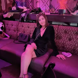 a woman sitting on a couch