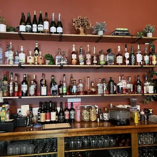 a bar with shelves full of alcohol bottles