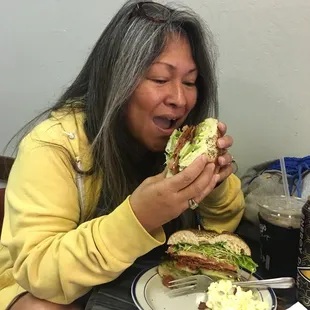 Sonja enjoy her deluxe sandwich at Fog City Java