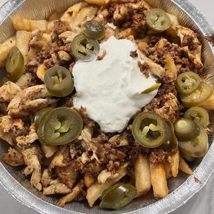Fries with chicken and chorizo