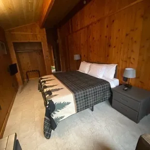 a bed with a plaid blanket