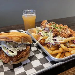 Nashville hot chicken sandwich, loaded fries, and a hazy beer