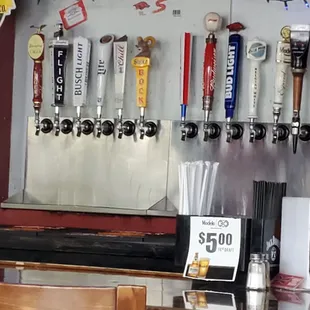 a wall of beer taps