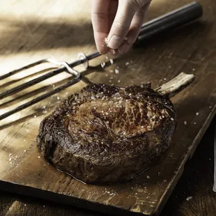 Bone-In Ribeye: Aged for 21 days for a richer flavor, and roasted slowly to retain the natural flavors of the meat on the bone.