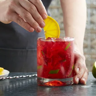 Strawberry Hibiscus Caipirinha: Silver cachaça, house-made hibiscus syrup, strawberries, and lime create this refreshing brazillian beverage