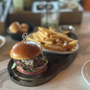 PICANHA BURGER: ground in-house, smoked provolone, Romaine lettuce, tomato, onion, chimichurri aioli, brioche bun sub. w/fries | $10