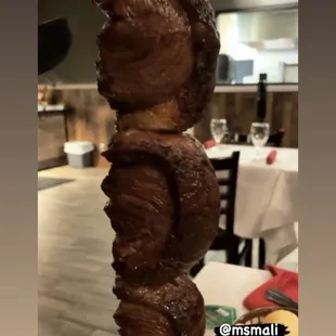 a skewer of meat on a stick