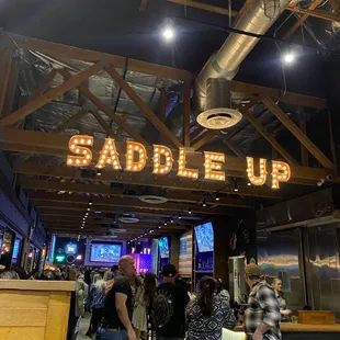 saddle up sign