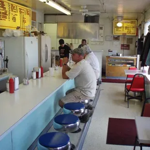 a man sitting at the counter