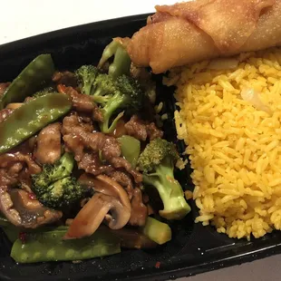 a plate of food with rice, broccoli, and meat