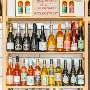 a shelf full of wine bottles