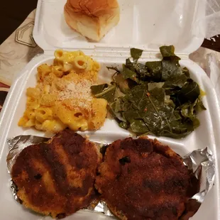 Salmon croquettes with organic greens and cabbage mix with msc n cheese served with dinner roll.