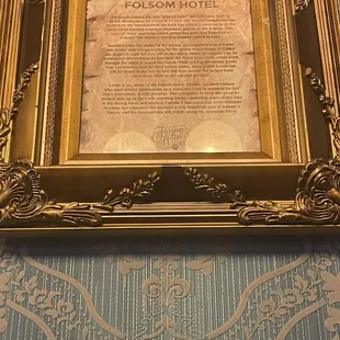 historic poem in gold frame