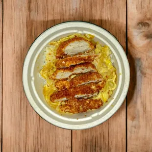 a plate of food on a wooden table