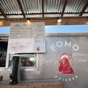 a food truck with a menu on the side