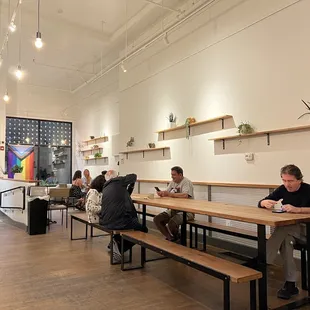 a group of people sitting at long tables