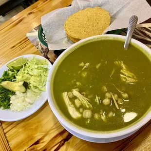 a bowl of soup and a plate of salad