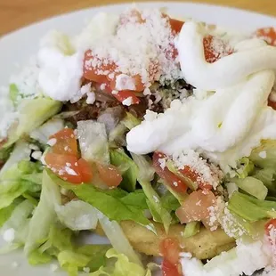 a closeup of a salad on a white plate