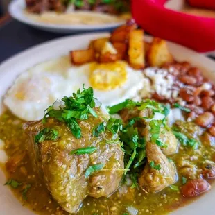 Huevos con puerco en salsa verde- eggs with pork and green sauce- pork very tender and sauce was good! ~ @seattle.food.diva