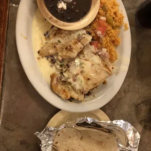 Pollo loco - chicken breast, chorizo, beans, rice, cheese sauce, tortillas, and a couple veggies.  Yum!