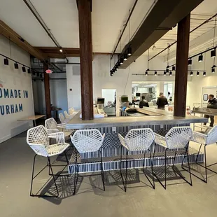 a restaurant with a bar and chairs