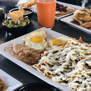 Delicious spicy hot chilaquiles! The bomb! With eggs, chicken breast or meat, y u m m y ! !